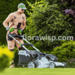 Man mowing a green lawn with a lawn mower, illustrating lawn care cost.