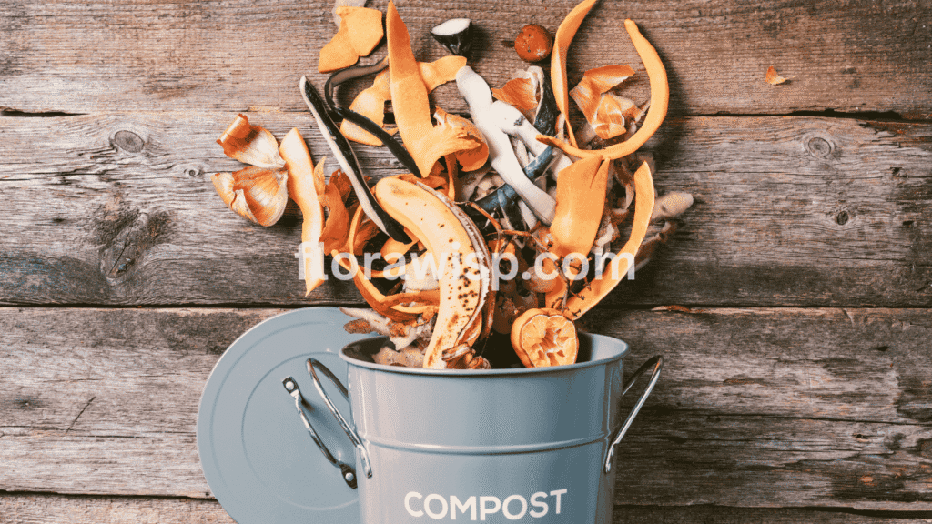 Best homemade fertilizer for flowering plants made with banana peel and coffee grounds shown in a compost box
